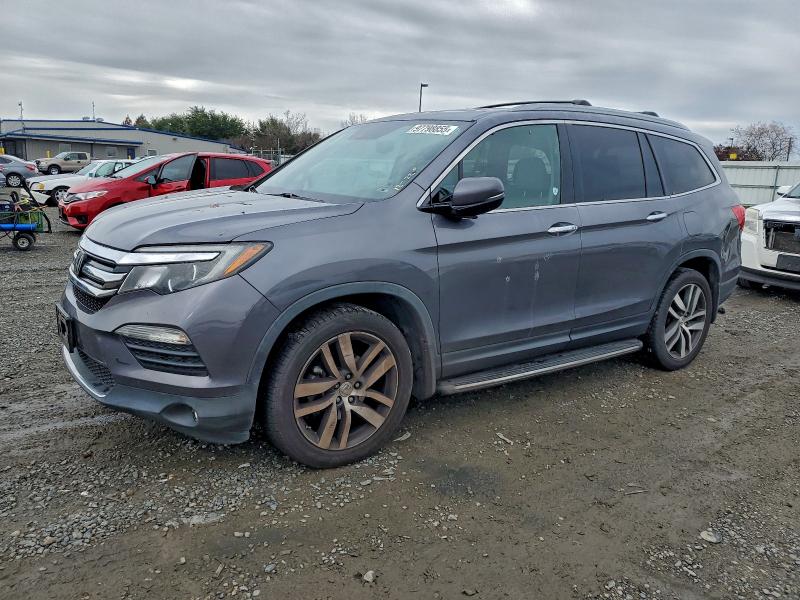 HONDA PILOT TOUR 2016 with VIN 5FNYF6H96GB022863 - Photo from auction