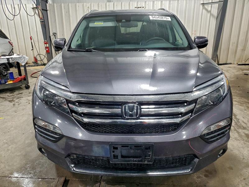 Photo 5 from auction – 2018 HONDA PILOT TOUR with VIN 5FNYF6H91JB019649