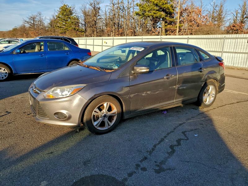 FORD FOCUS SE 2014 with VIN 1FADP3F23EL297557 - Photo from auction