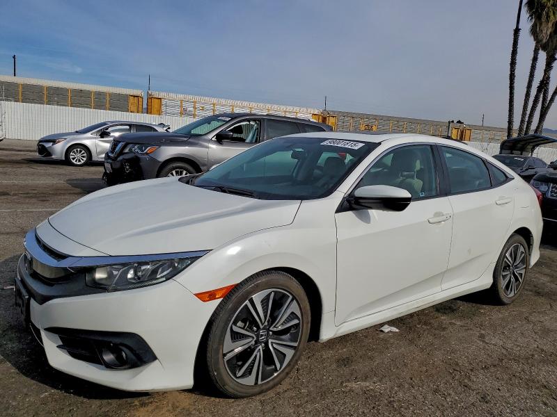 HONDA CIVIC EX 2016 with VIN 2HGFC1F33GH656841 - Photo from auction