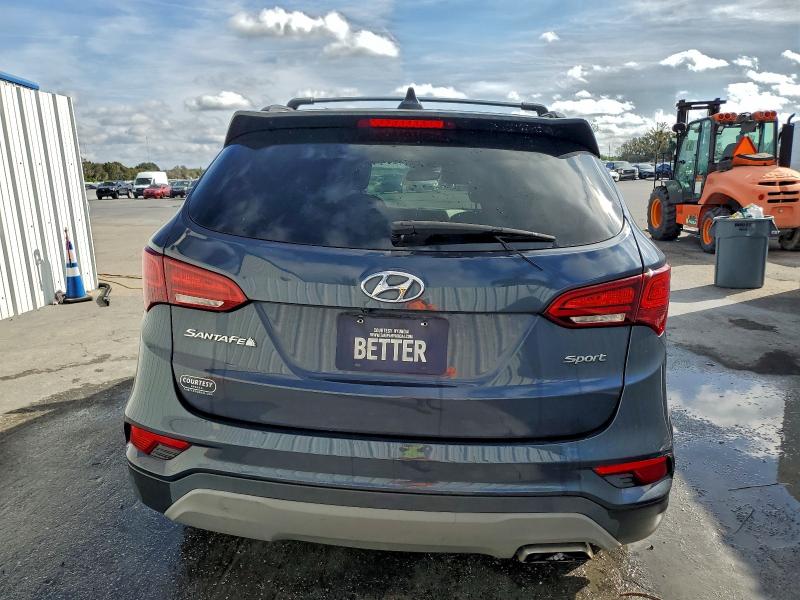 Photo 6 from auction – 2018 HYUNDAI SANTA FE S with VIN 5NMZU3LB1JH103150